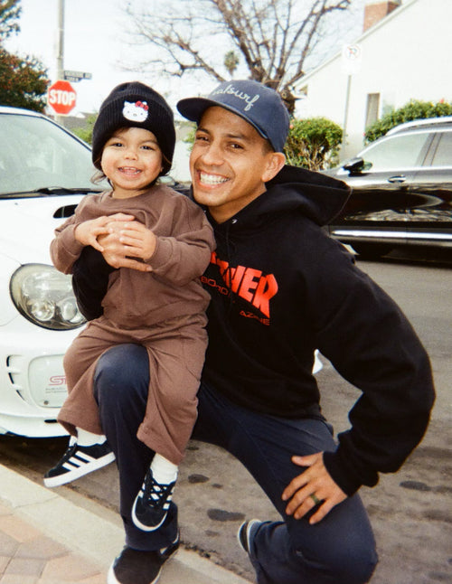 Gio Szabo and his daugher with cars in the background