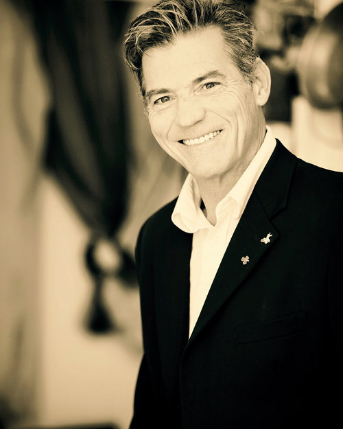 Deano Mueller in a suit with a blurred background