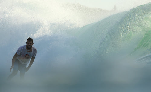 Pascal Stansfield surfing on a wave